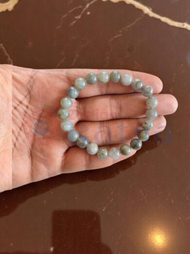 Close up of 8mm natural flashy Labradorite bracelet vibrant hues