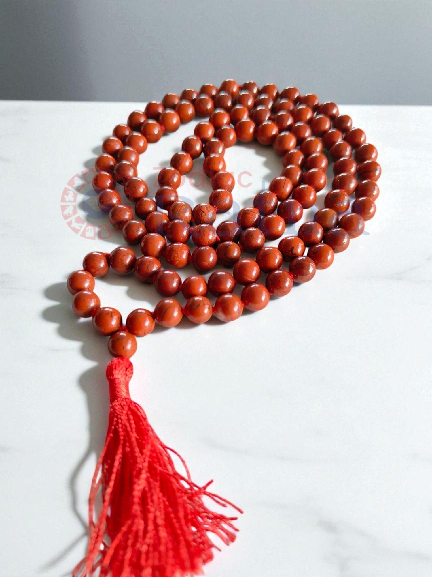 Close up of natural Red Jasper beads with earthy red tones